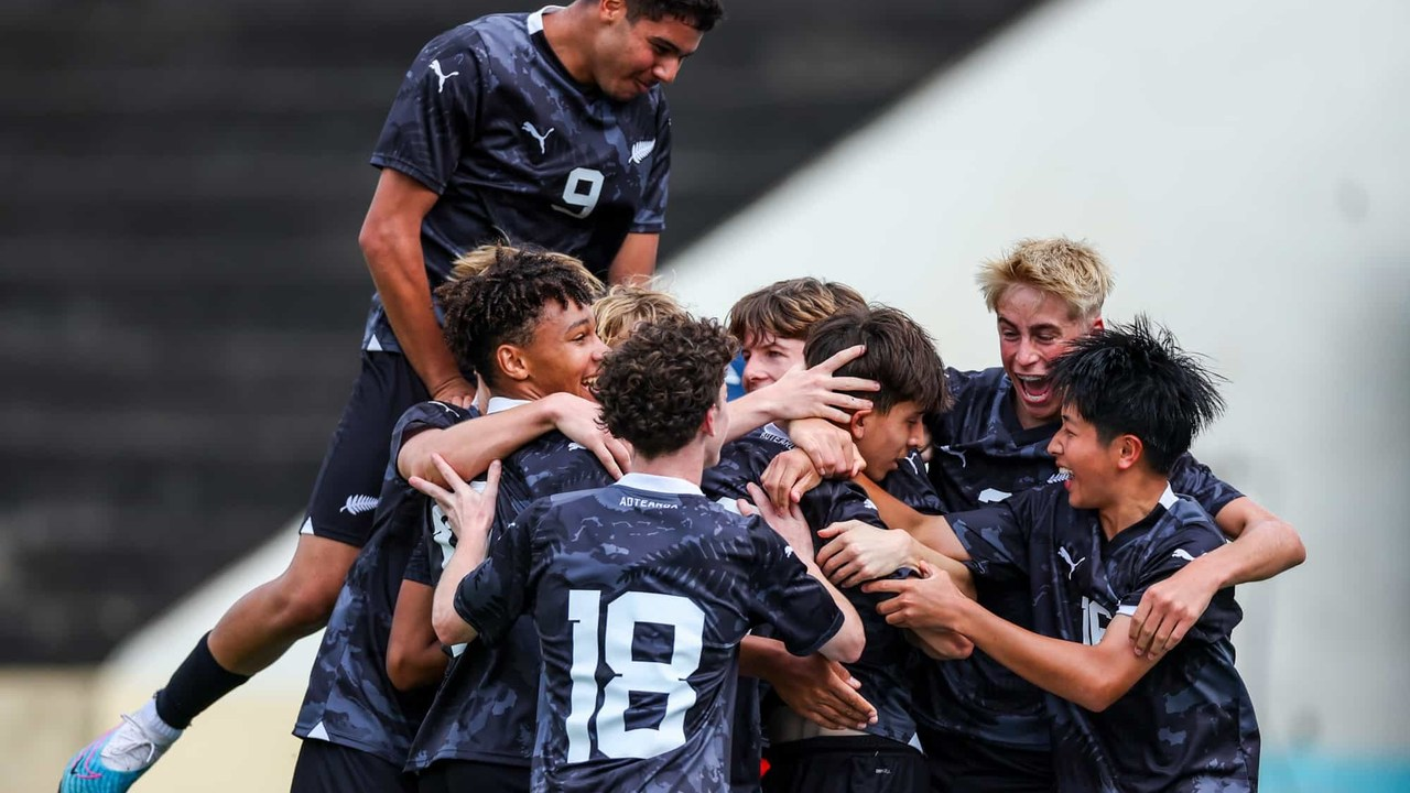 Aaron Cartwright celebrates with New Zealand youth teammates