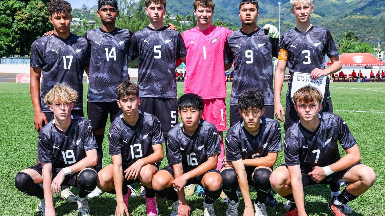 New Zealand youth footballers stand together before a match