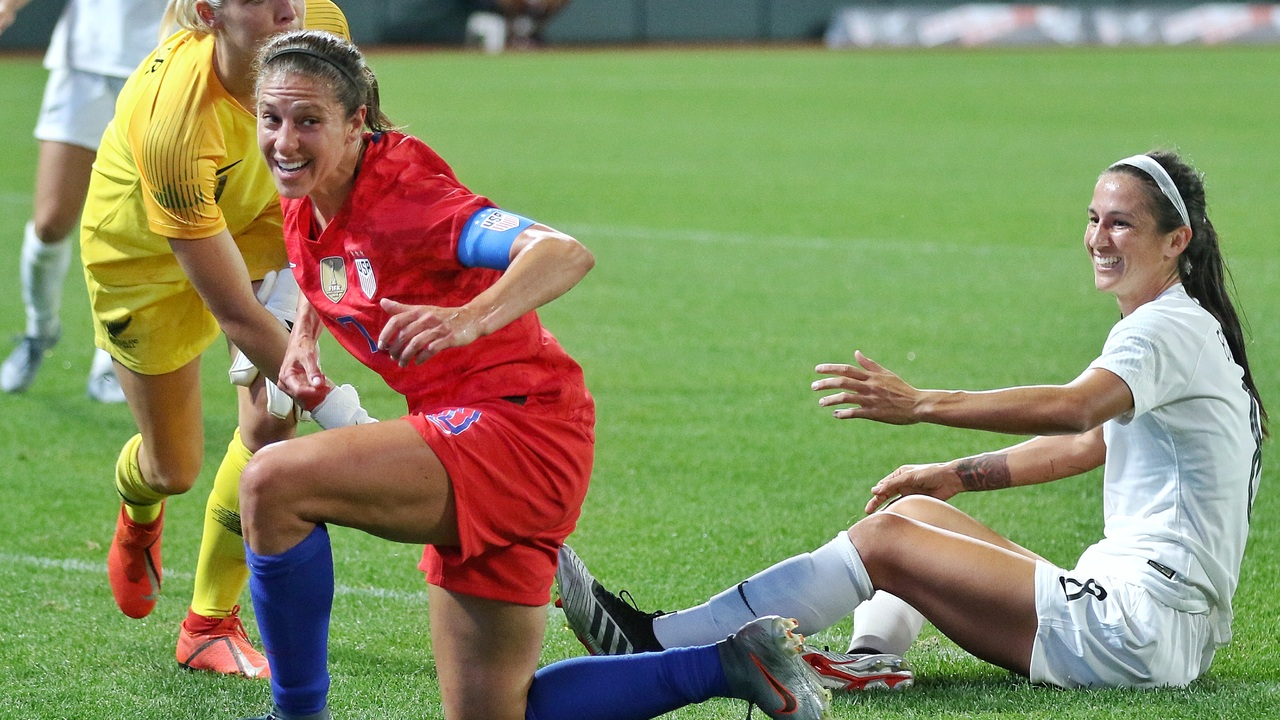 Abby Erceg challenges Carli Lloyd during a club match