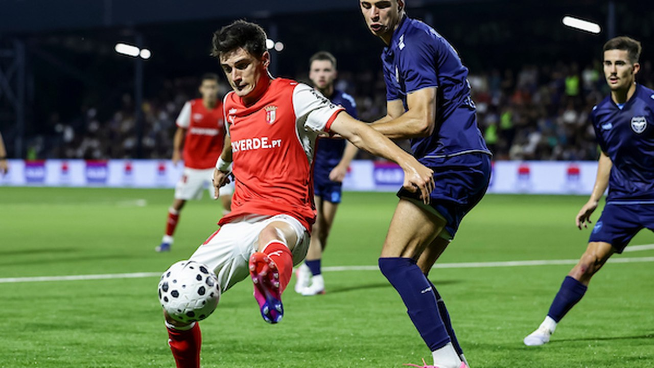 A Zeleznicar player shields the ball from a Braga defender