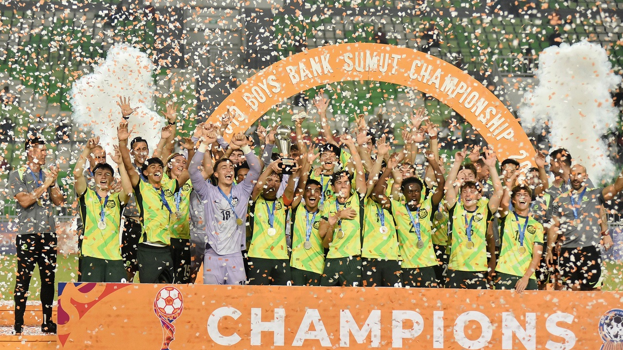 Young Socceroos players celebrate with the ASEAN U19 championship trophy