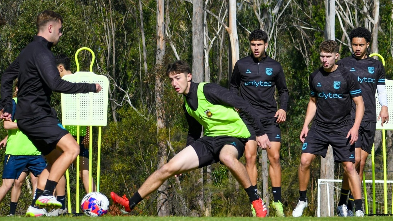 Central Coast Mariners players train together on an outdoor pitch