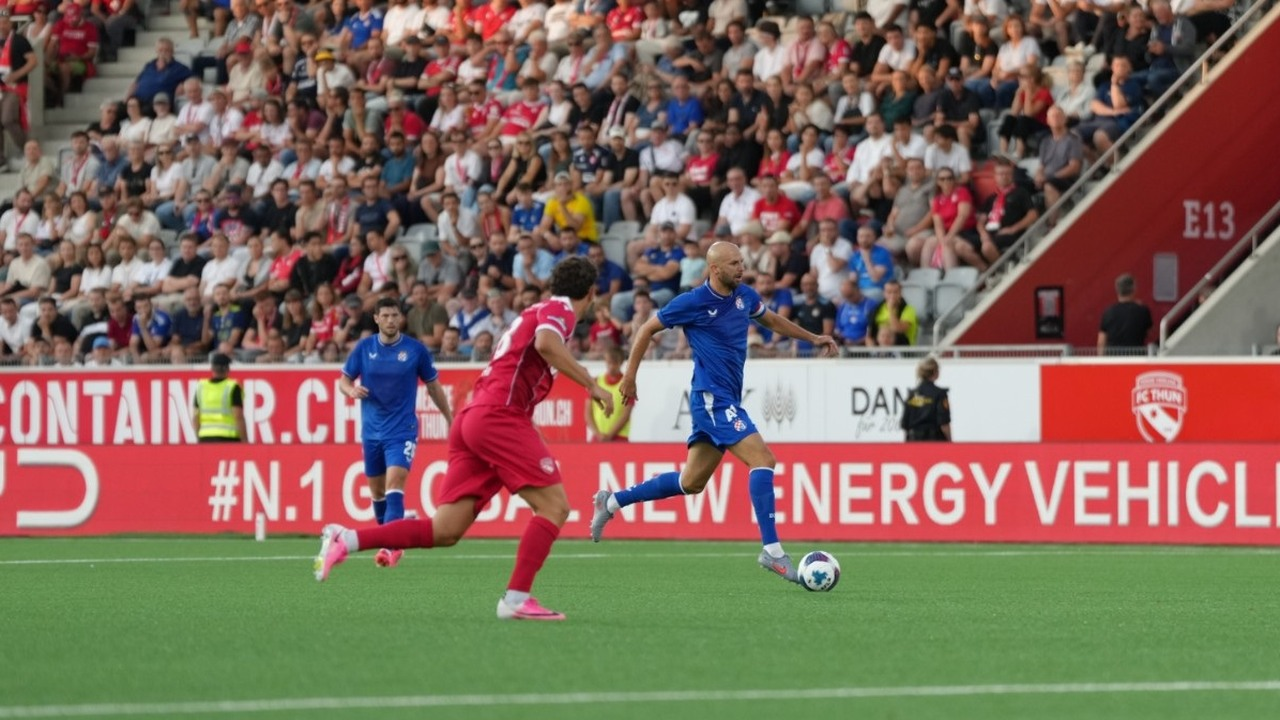 Thun players defend their penalty area during a match