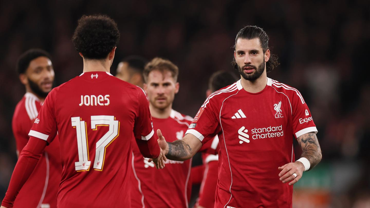 Dominik Szoboszlai celebrates with Liverpool teammate Curtis Jones after a match
