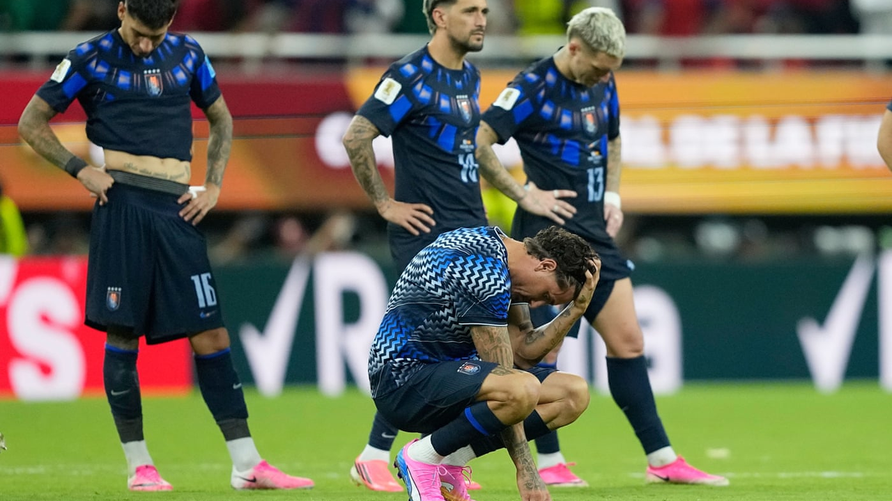 Uruguay players react after the World Cup exit that preceded Forlan's appointment