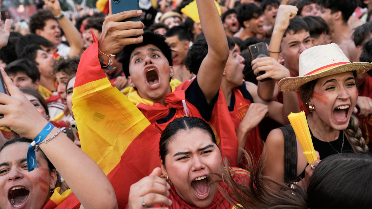 Supporters watching a 2026 World Cup match at a public fan festival