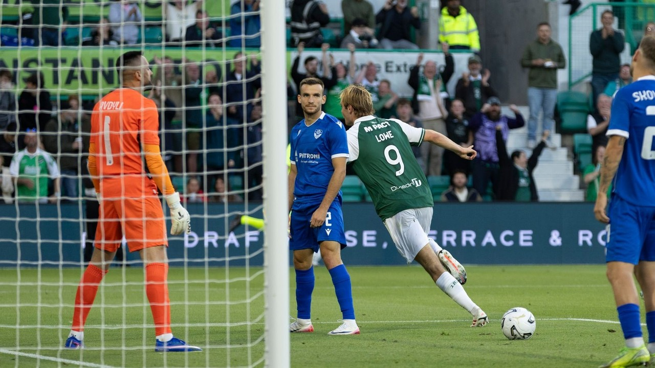 Hibernian and KF Malisheva players watch the ball near the goal