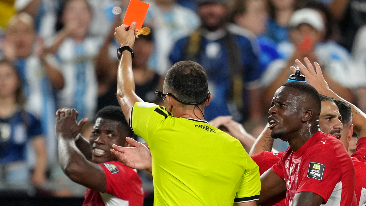 Referee showing a red card during Argentina's World Cup quarter-final against Switzerland