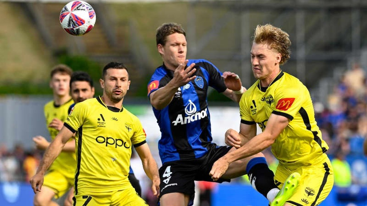 Louis Verstraete challenges for the ball in an Auckland FC match