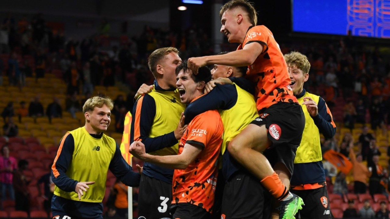 Macklin Freke celebrates with Brisbane Roar teammates
