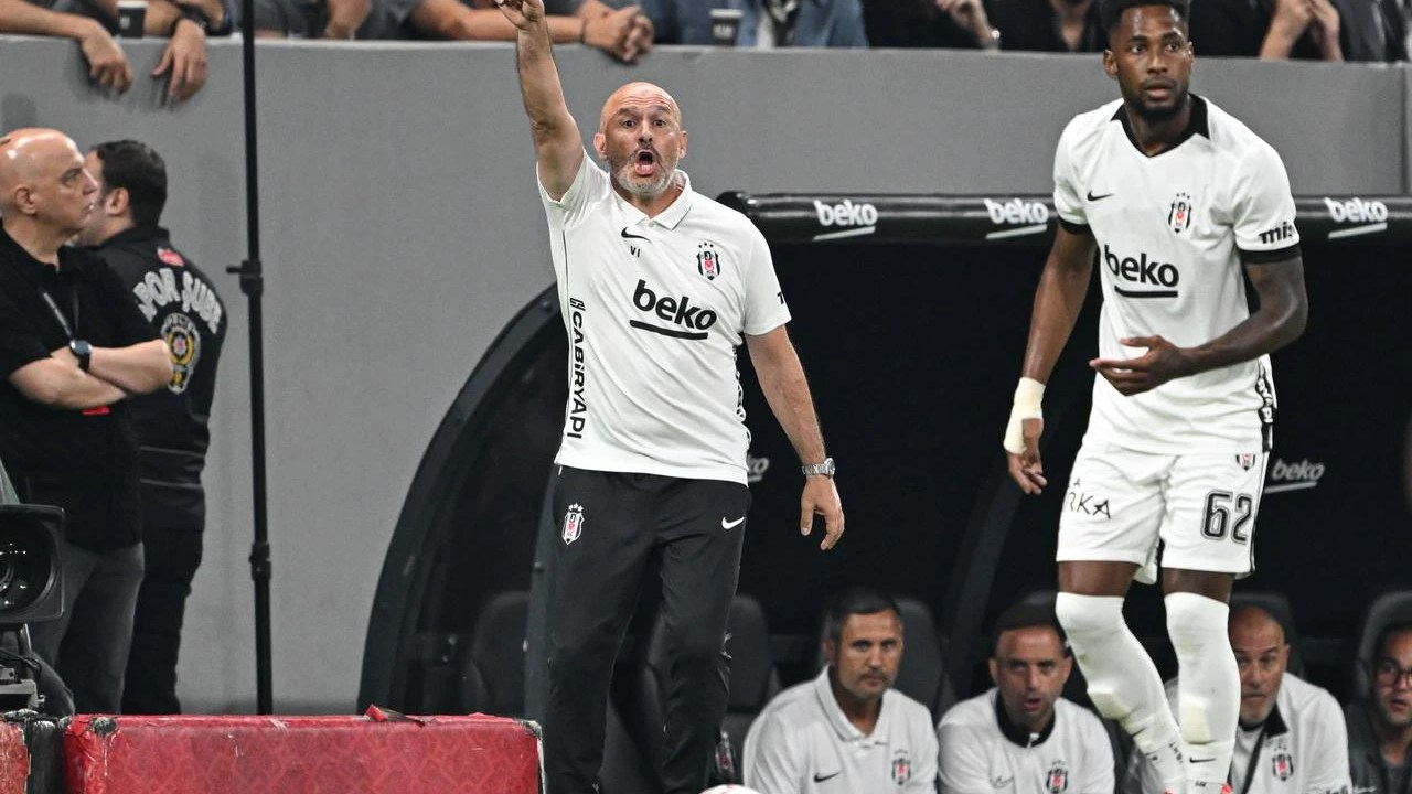 Beşiktaş coach Vincenzo Italiano celebrates beside the pitch