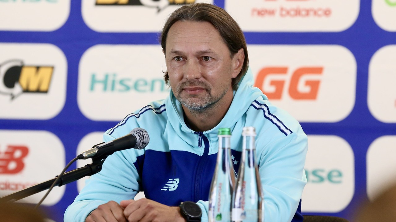 A coach speaks after the Dynamo Kyiv and PAOK match
