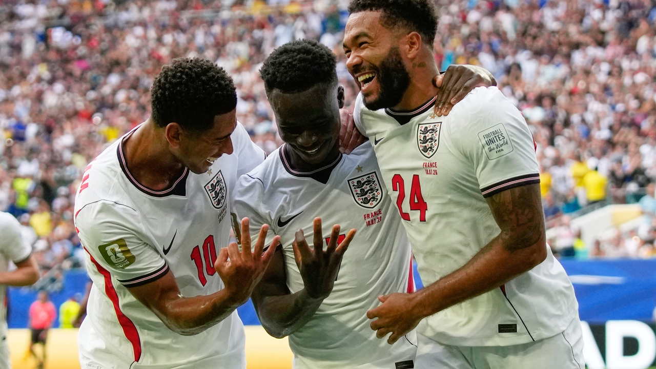 Bukayo Saka celebrates with England team-mates against France