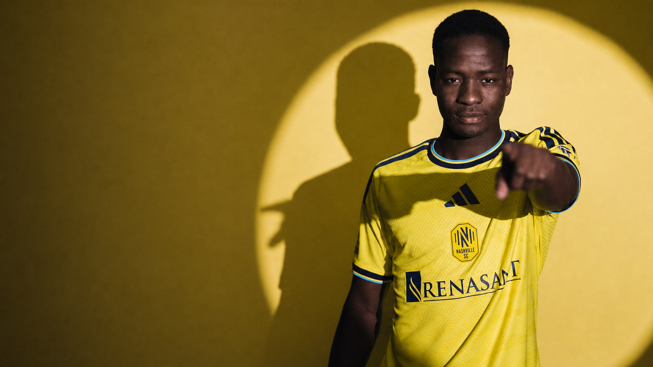 Shak Mohammed poses in Nashville SC's yellow 2026 home shirt