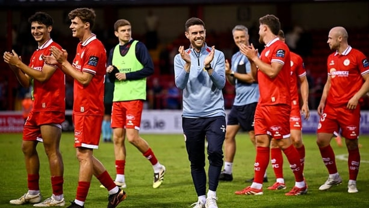 Shelbourne players and staff applaud after the match