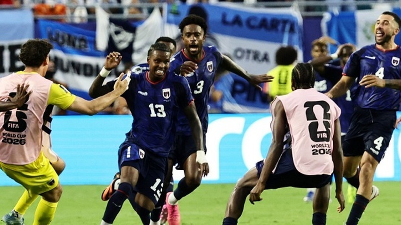 Sidny Cabral and Cape Verde teammates celebrate beside the pitch