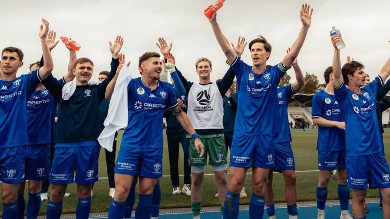 South Melbourne players in blue acknowledge supporters after a match