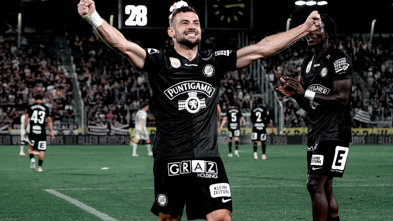 Sturm Graz players celebrate in front of their supporters