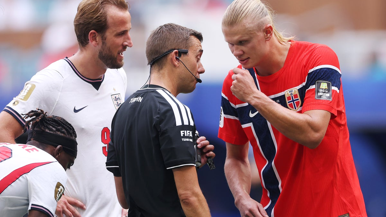 England and Norway players near a match official during the quarter-final