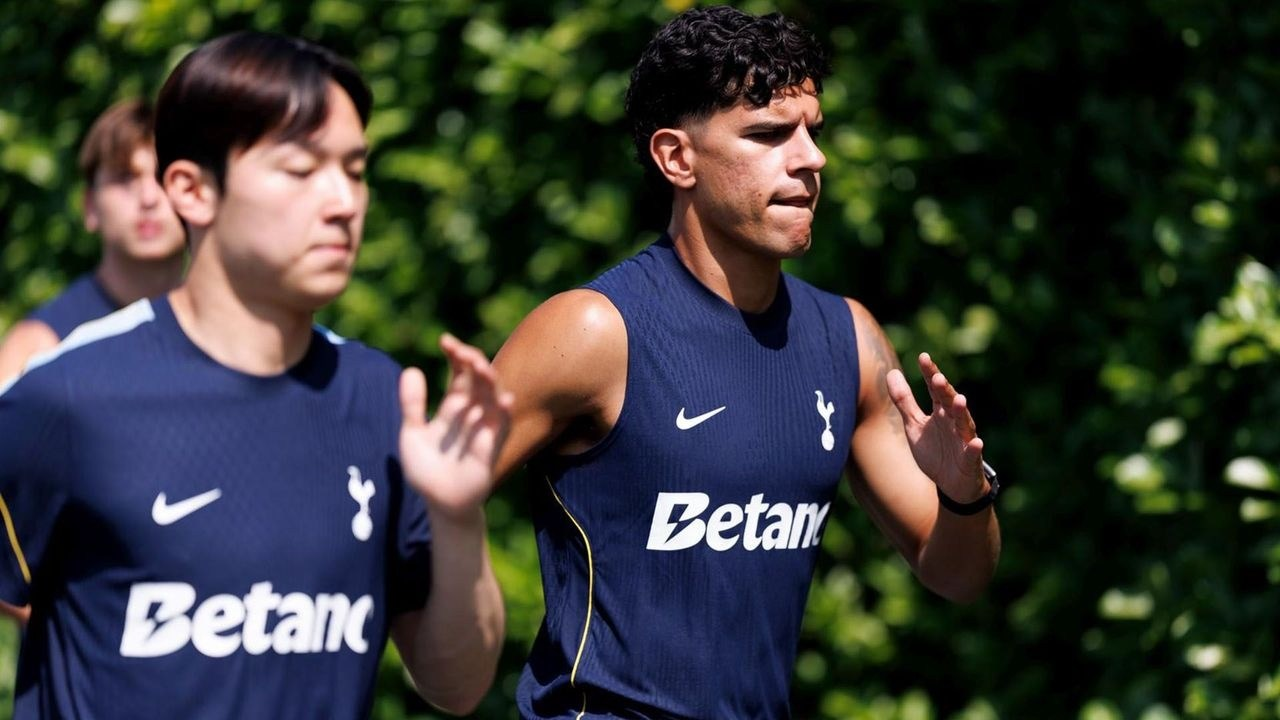 Tottenham players run during a pre-season training session