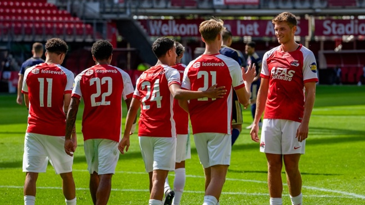 PSV players stand together on the pitch
