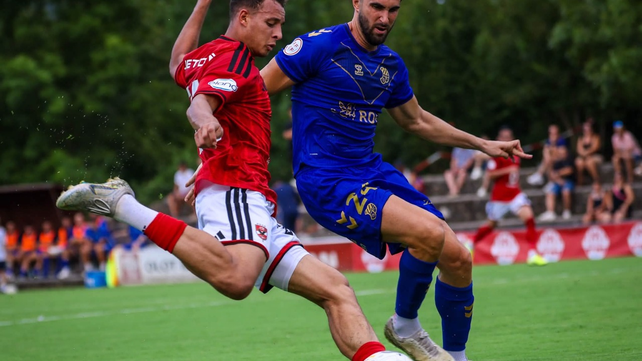 An Al Ahly player contests the ball against CE Europa