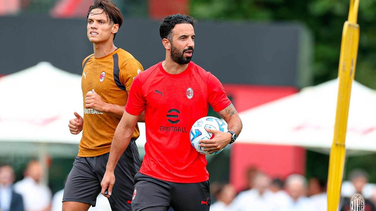 AC Milan players train together on a football pitch