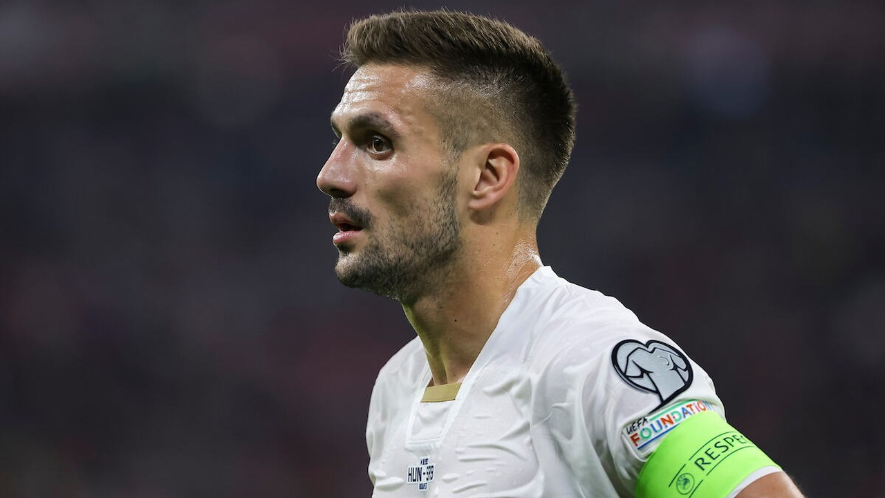 Dusan Tadic wears the Serbia captain's armband during a match