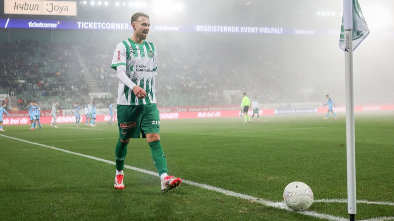 A St Gallen player speaks with the referee