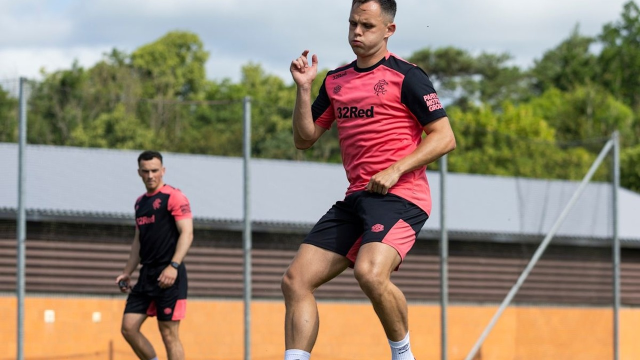 Rangers players train together on a football pitch