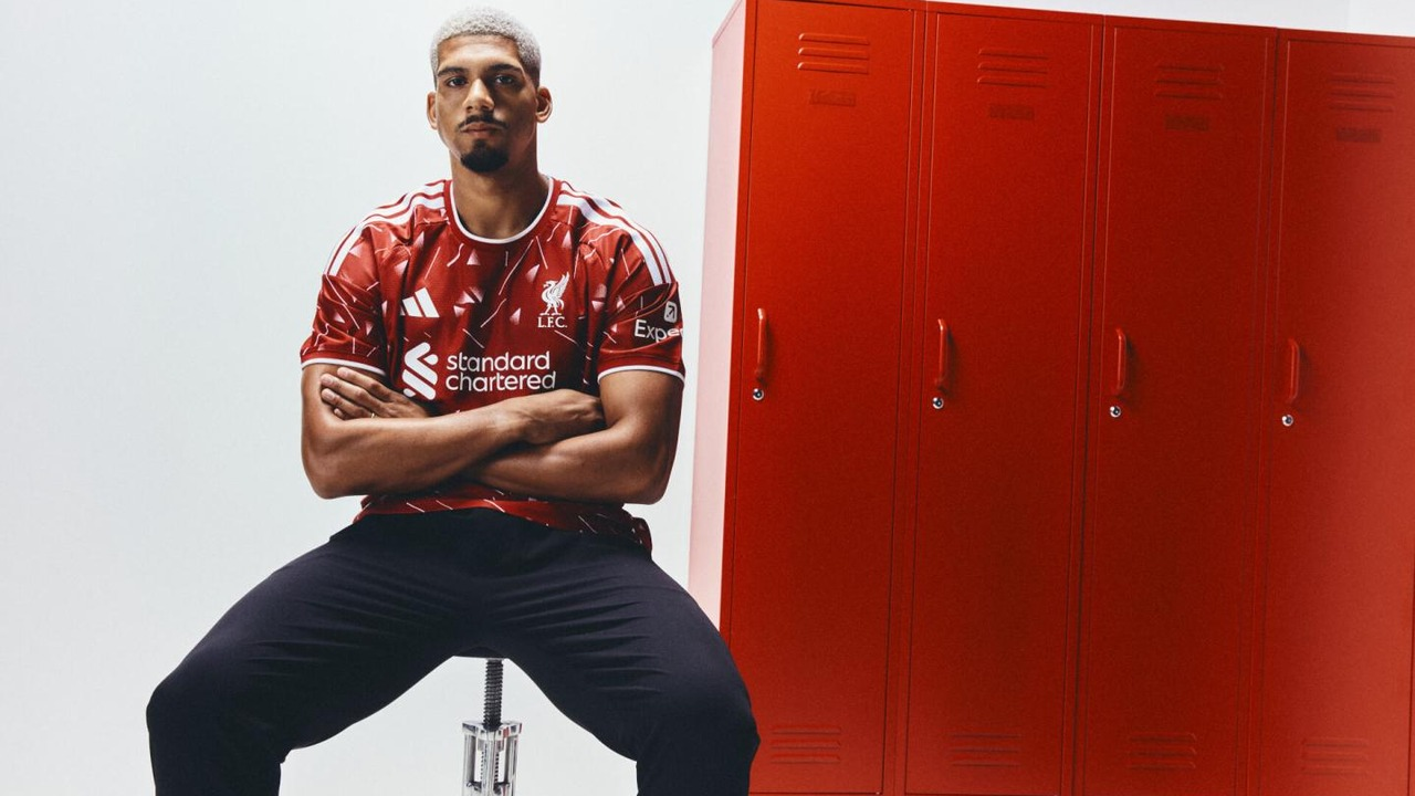 Ronald Araujo stands in Liverpool clothing inside the dressing room