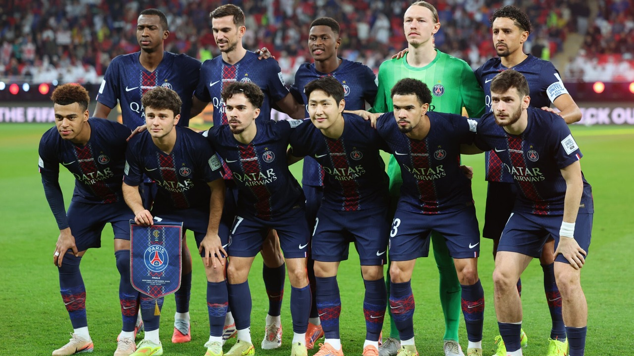Paris Saint-Germain players pose together before a football match