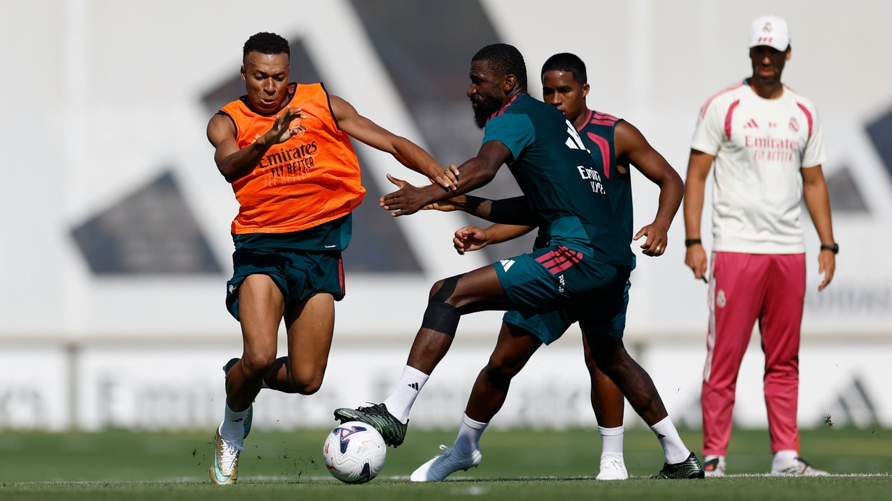 Real Madrid players train together on the grass