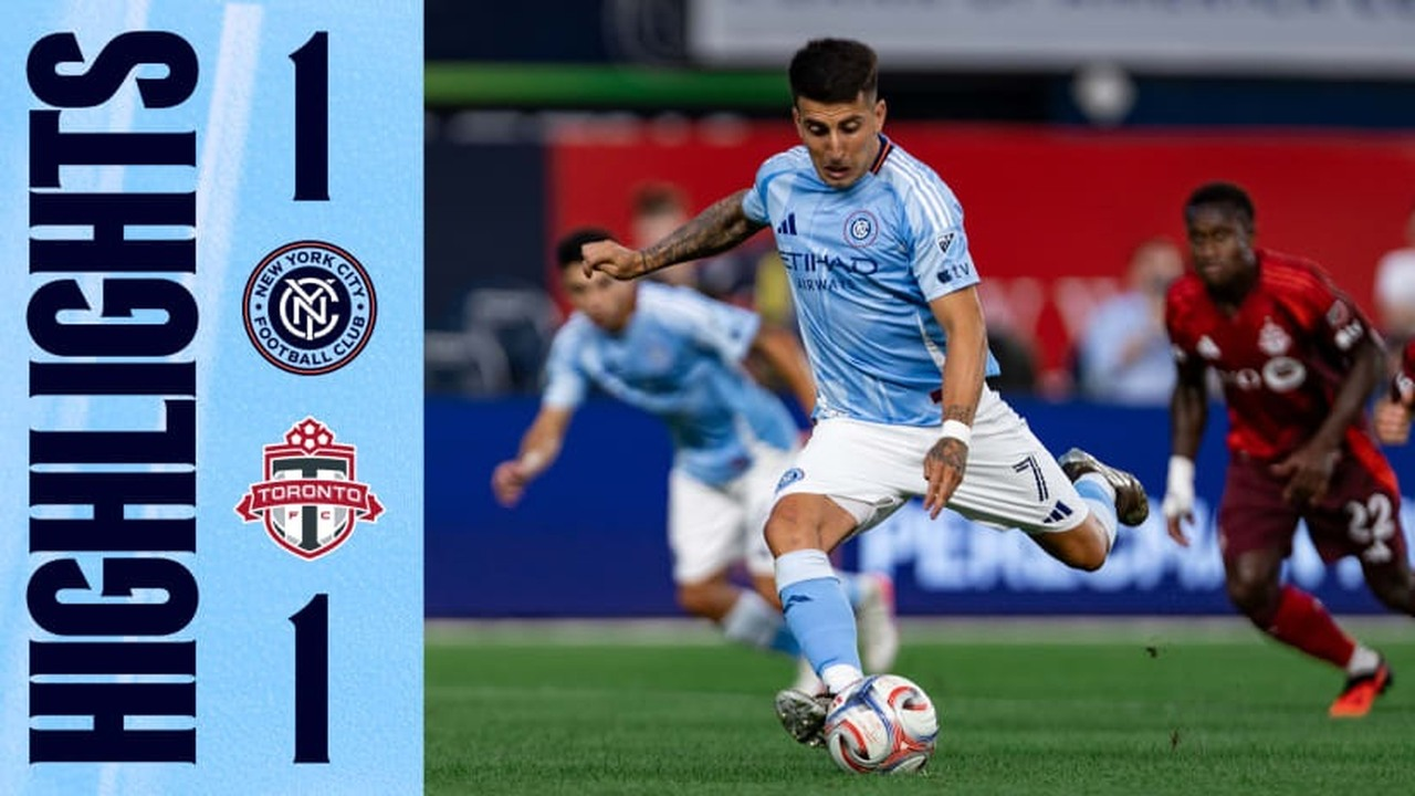Toronto players defend inside the penalty area against New York City