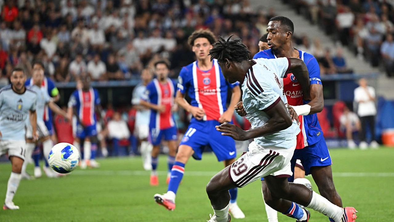 Paris Saint-Germain and Aston Villa players contest the ball