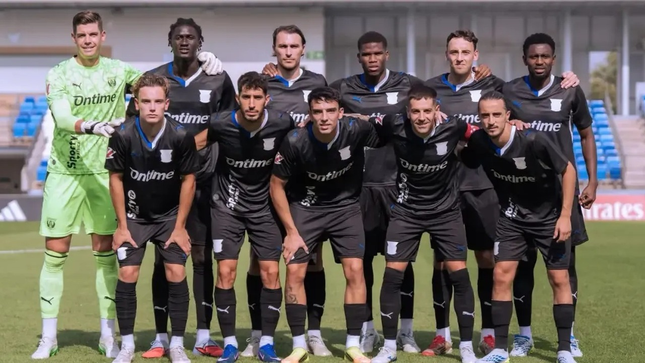 Leganes players pose before a match
